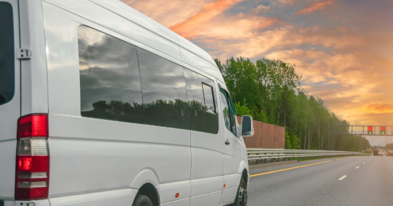charter bus moving thrrough the city